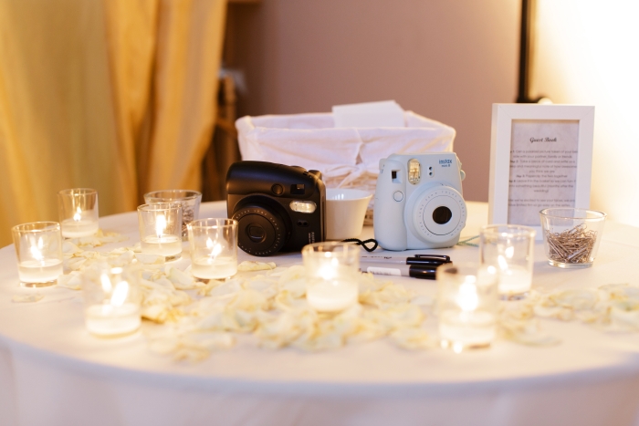 Wedding guest book created with polaroid photos - photo credit Blue Sky Photography