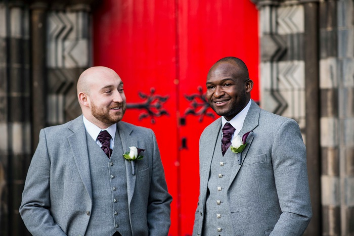A groom and best man wait outside Mansfield Tranquair, Edinburgh for the wedding to start