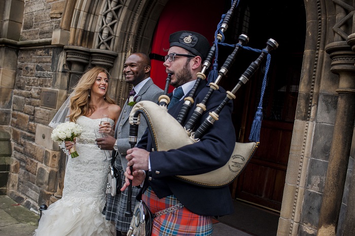 A happy bride and groom outside Mansfield Tranquair, Edinburgh